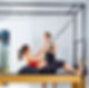 pregnant-woman-pilates-reformer-roll-up-